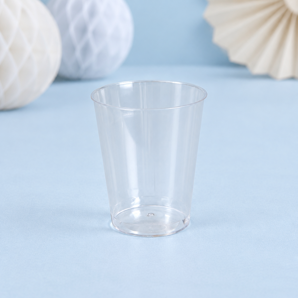 Klart PS-shotglas på blå festbordplade