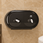 Sort Tork SmartOne Mini Twin T9 på varm stenfarvet toiletvæg