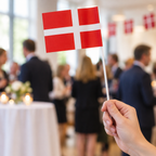 Papirflag på pind i brug ved en reception