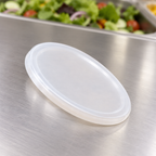 Plastlåg til dressingbæger ved salatservering