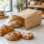 Stemningsbillede af brun papirpose med brød og tørkager, ikke foto af den konkrete bagerpose