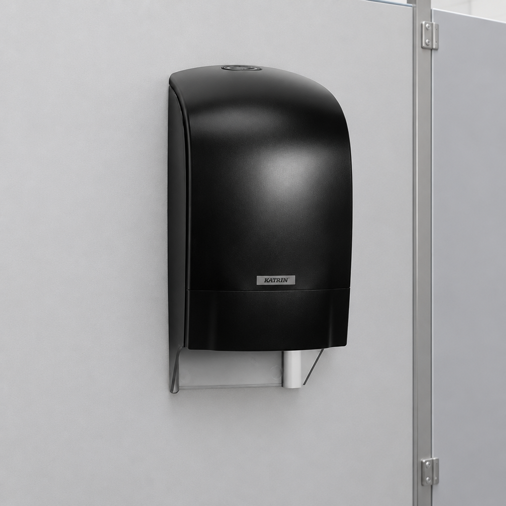 Sort Katrin-toiletrulledispenser ved toiletrumsskillevæg