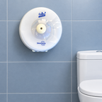 Hvid Lotus SmartOne Mini T9-dispenser på blågrå væg ved toilet