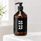 Luxus Naturel 500 ml pumpeflaske på kanten af en lys håndvask