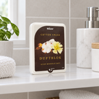 Stemningsillustration af Minatol Cotton Fresh duftblok med frontpapir på badeværelseshylde
