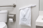 Klemme til madameposer monteret på væg i offentligt toilet