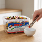 Haribo Click Mix fordeles med tang i en serveringsskål