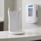 Hvid drypbakke i forgrunden med passende Purell LTX-12-dispenser i baggrunden