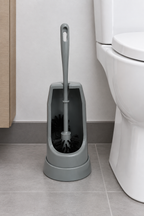 Grå toiletbørste ved kontortoilet, stemningsillustration