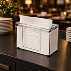 Katrin borddispenser med hvide håndklædeark på mørk restaurantbordplade